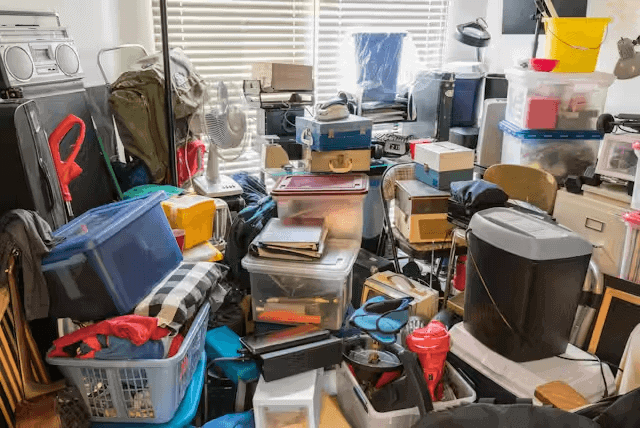 Cluttered room filled with assorted items and boxes