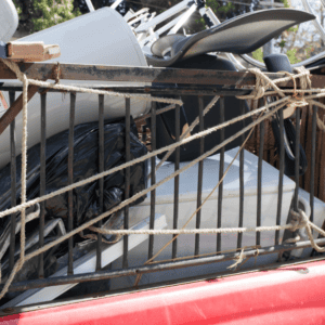 Truck bed loaded with assorted tied-down equipment