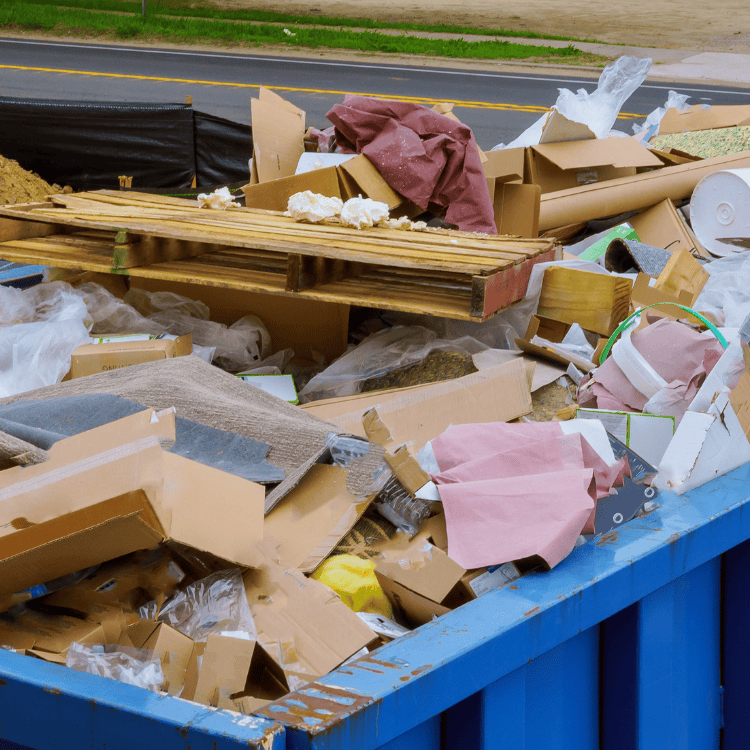 Overflowing construction dumpster full of debris