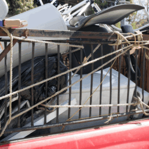 Overloaded truck with assorted junk and appliances