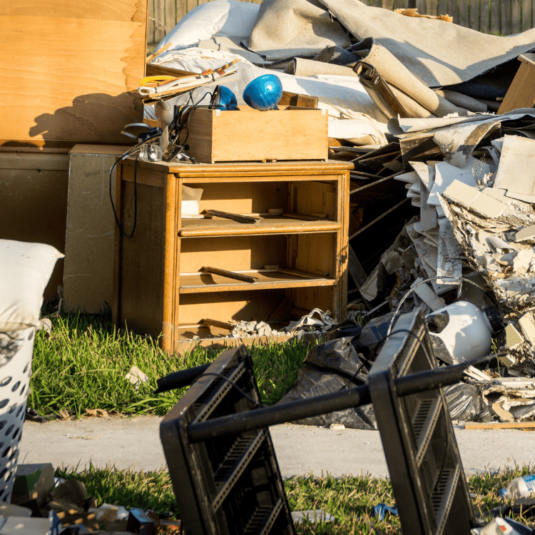 Pile of household debris and damaged furniture outdoor